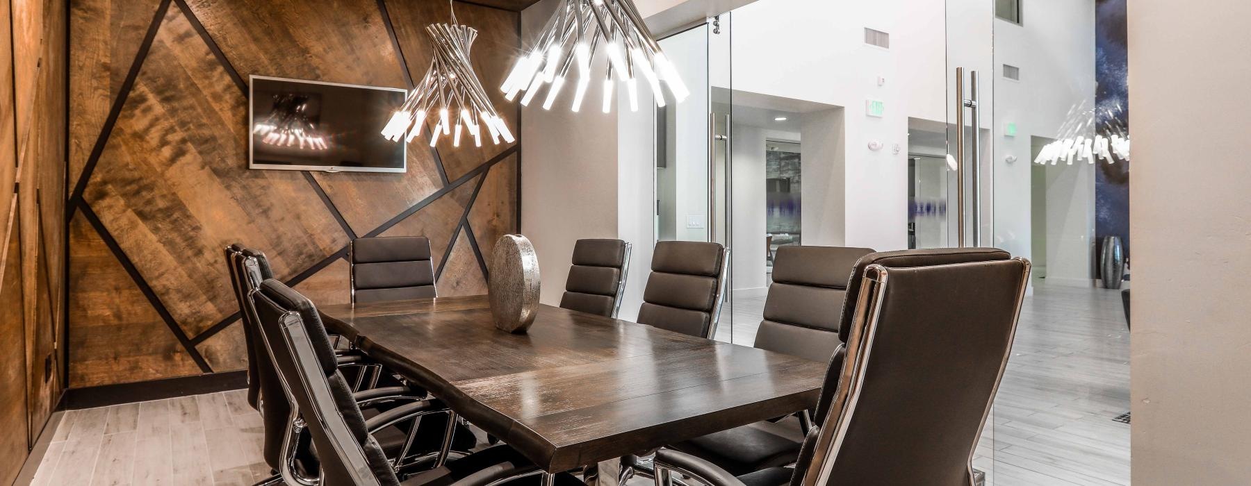 Take advantage of all Two Nine North has to offer a dining room table with chairs around it