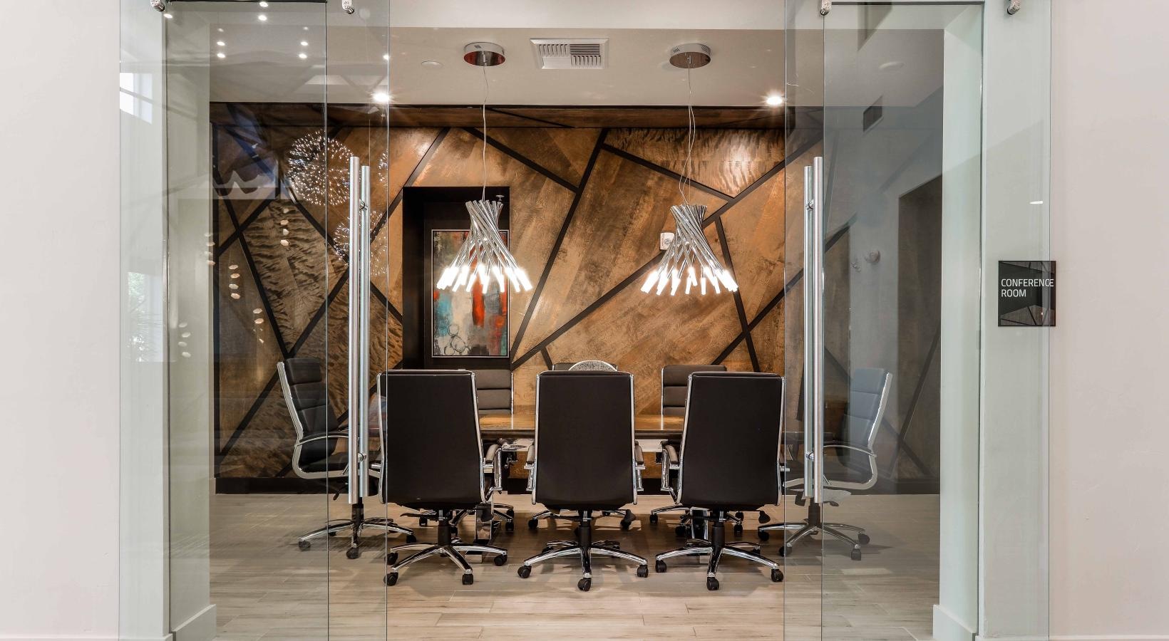 Everything within reach a room with chairs and a chandelier