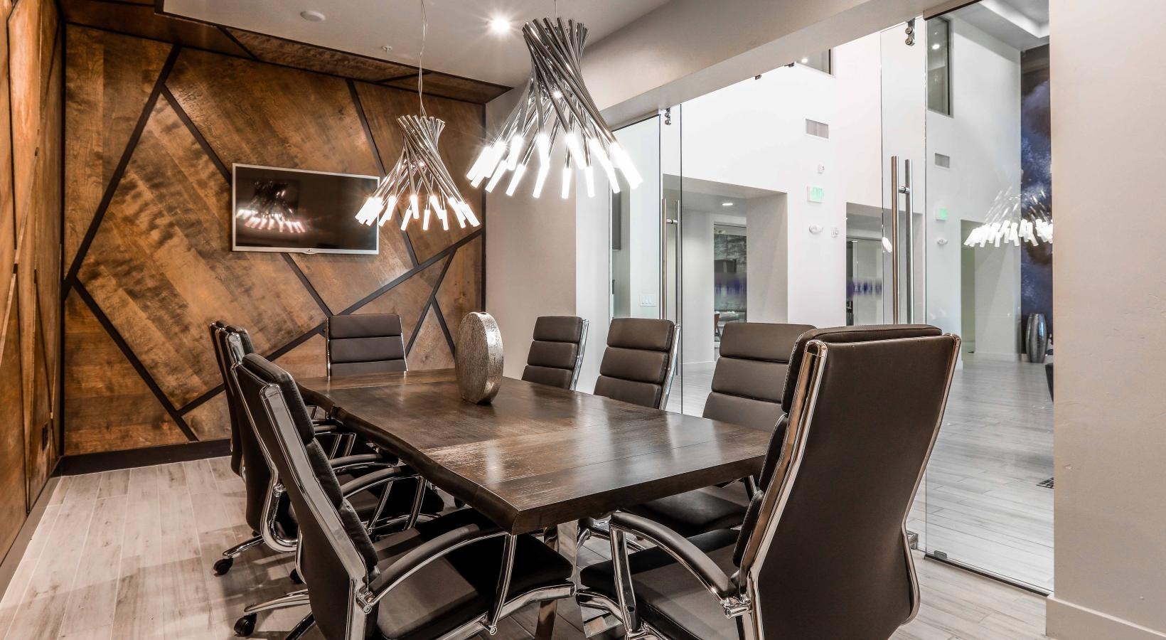 Take advantage of all Two Nine North has to offer a dining room table with chairs around it