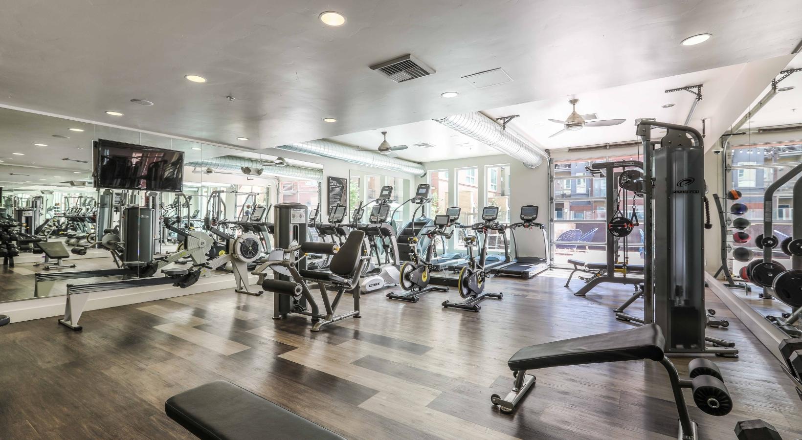 State-of-the-art amenities a gym with exercise equipment