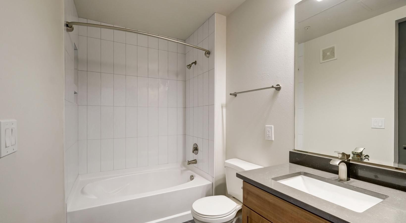 Bathroom options with thoughtful details a bathroom with a tub toilet and sink