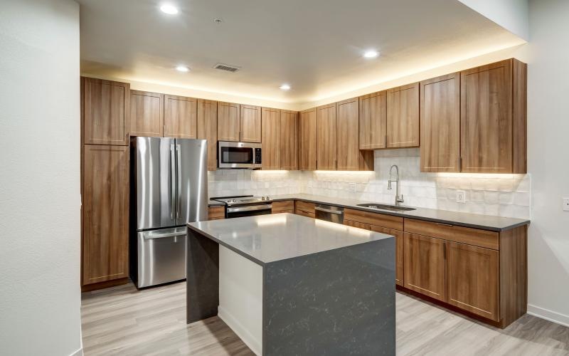 Spacious kitchens with thoughtful details a kitchen with wooden cabinets