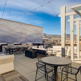 Access to resident-only features a patio with tables and chairs