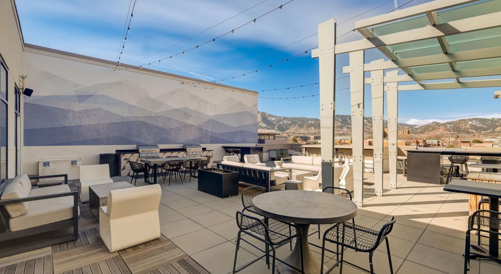 Access to resident-only features a patio with tables and chairs