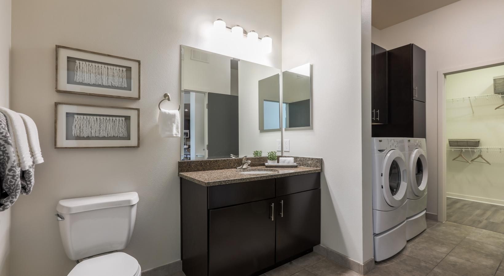 Bathroom options with thoughtful details a bathroom with a washer and dryer
