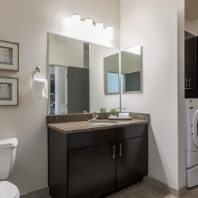 Bathroom options with thoughtful details a bathroom with a washer and dryer