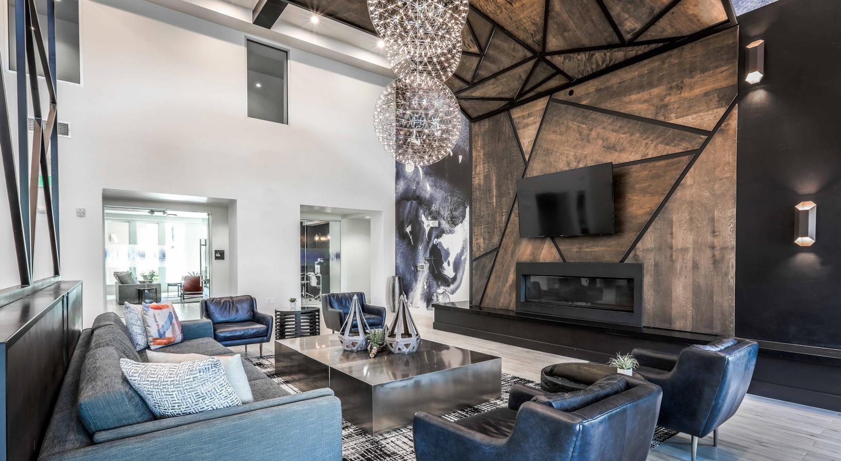 Access to resident-only features a living room with a chandelier and a couch