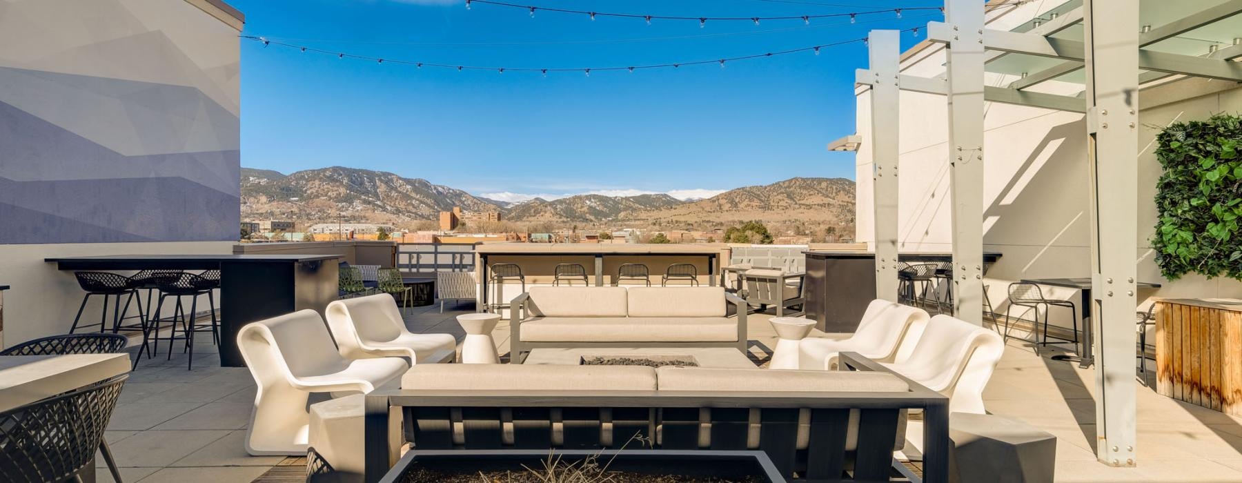 a patio with a pool and chairs