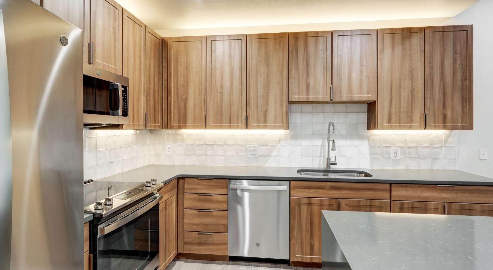 Beautiful kitchens with designer finishes a kitchen with wooden cabinets