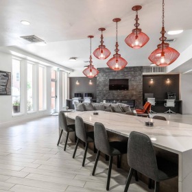 Everything within reach a large dining room with a large table and chairs