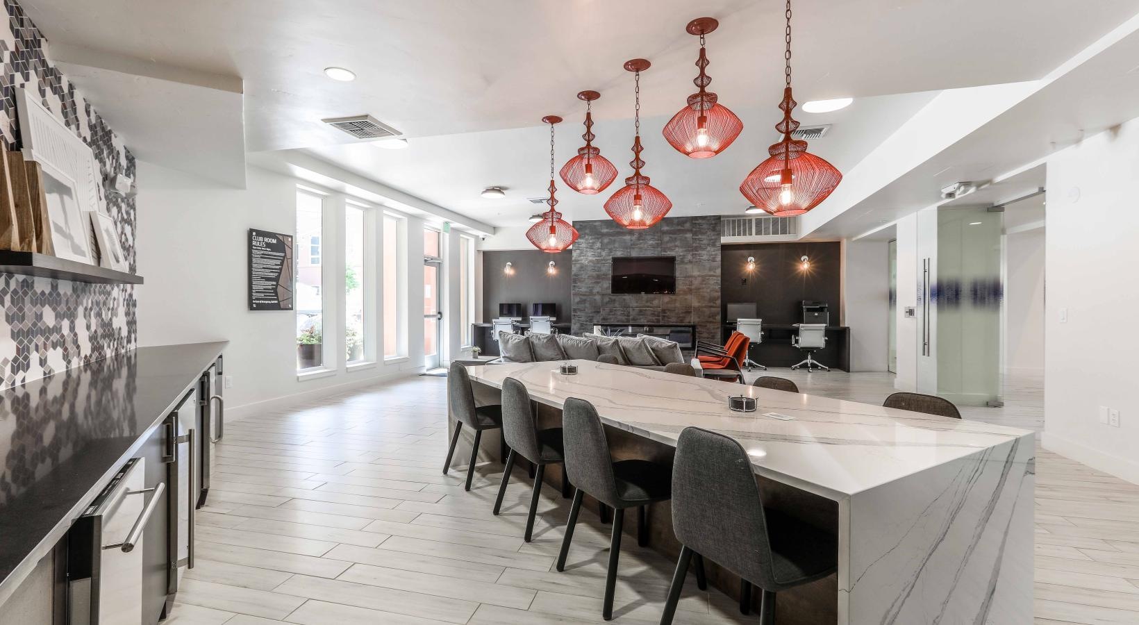 Everything within reach a large dining room with a large table and chairs