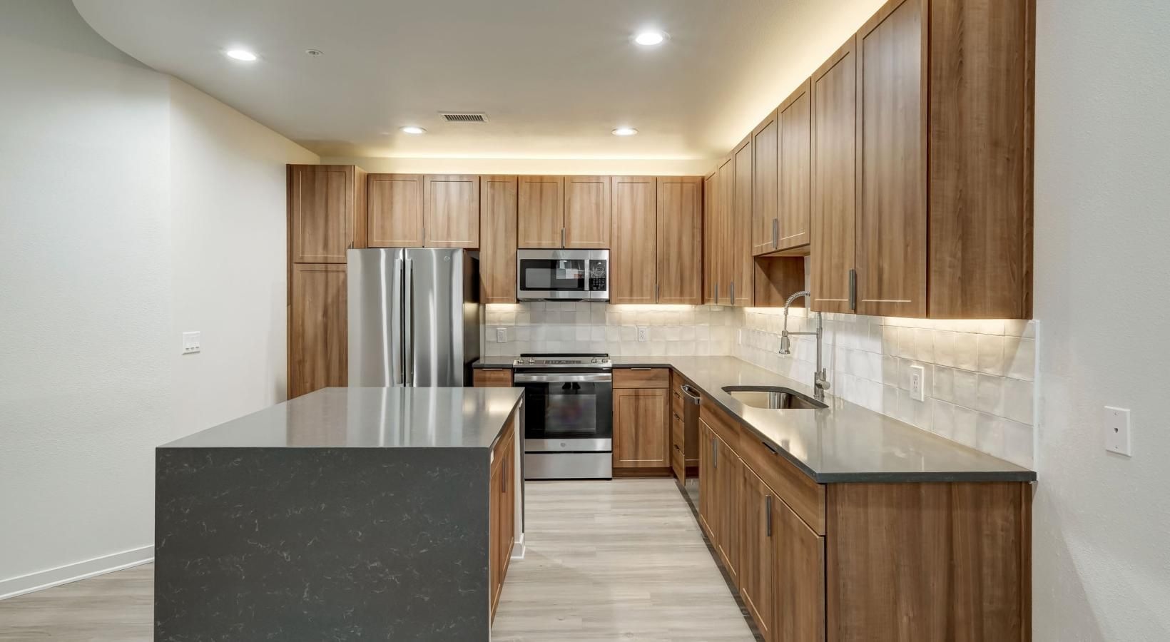 Beautiful kitchens with designer finishes a kitchen with wooden cabinets