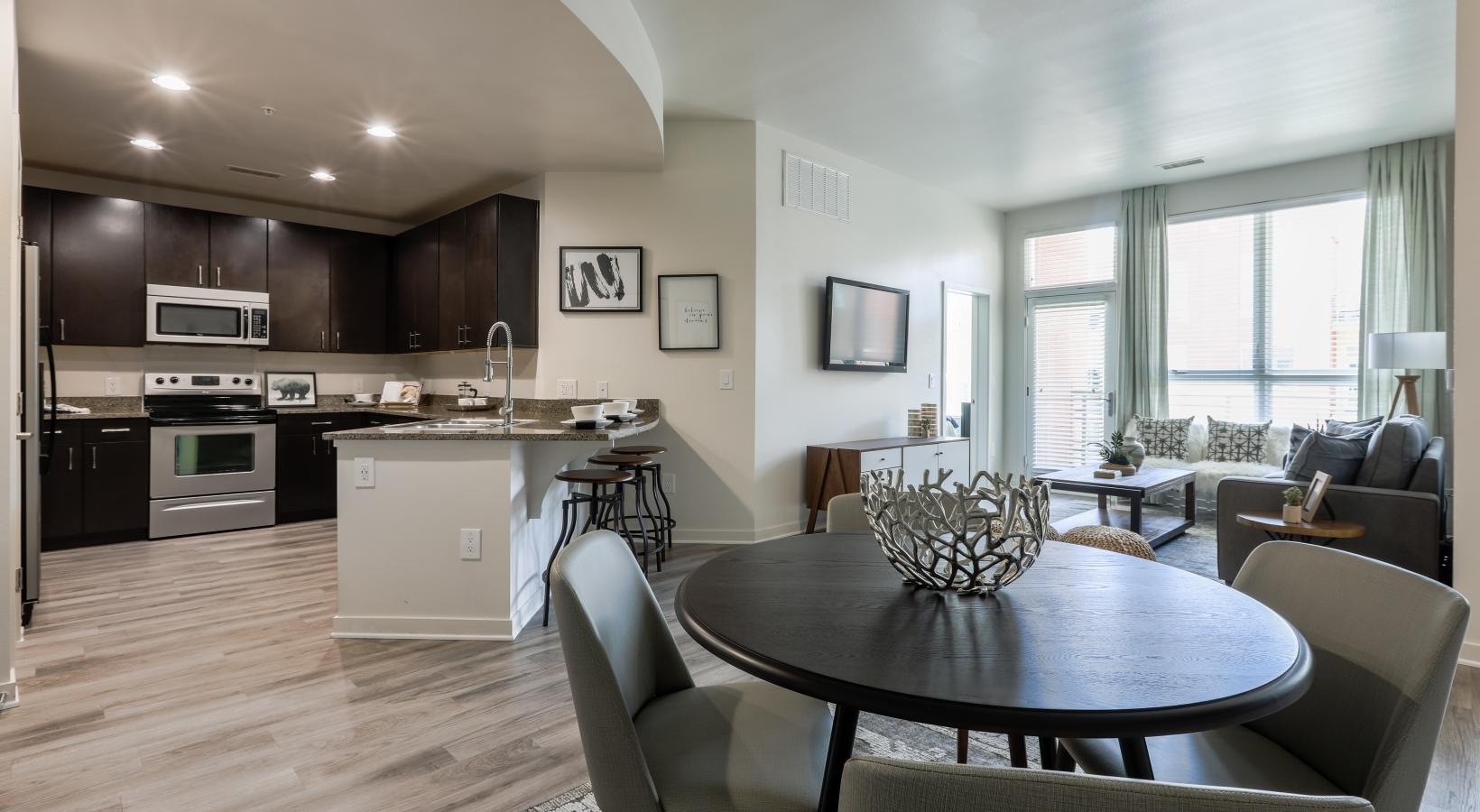 Spacious and well-lit living spaces a large kitchen with a dining table