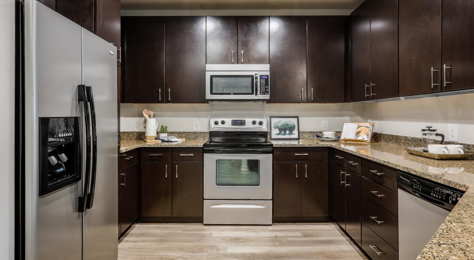 Spacious kitchens with thoughtful details a kitchen with black cabinets